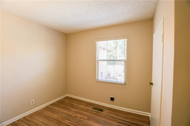 3477 Avenida Simi, Simi Valley, CA 93063 - unfurnished room with dark wood-style flooring, visible vents, baseboards, and a textured ceiling
