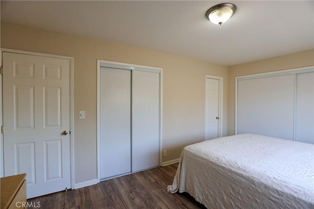 3477 Avenida Simi, Simi Valley, CA 93063 - bedroom with baseboards, two closets, and dark wood-style floors