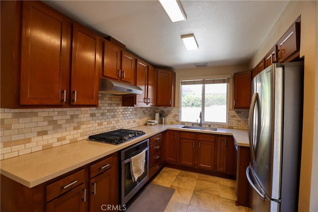 3477 Avenida Simi, Simi Valley, CA 93063 - kitchen with tasteful backsplash, under cabinet range hood, light countertops, a sink, and stainless steel appliances
