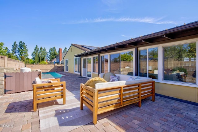 view of patio featuring a fenced backyard, an outdoor living space, and a fenced in pool