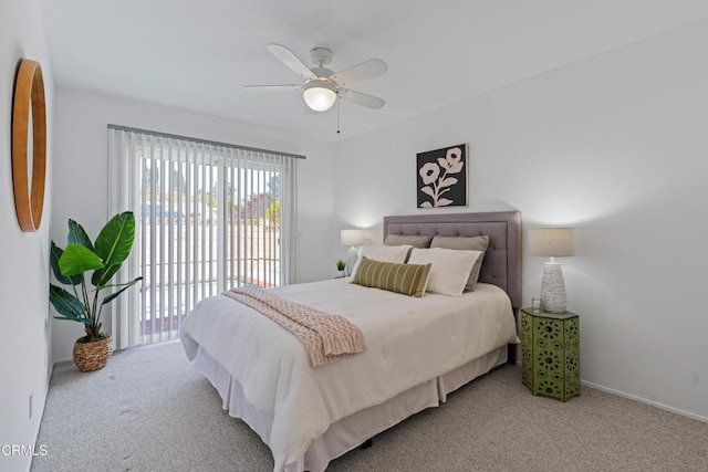 carpeted bedroom with baseboards, access to outside, and a ceiling fan