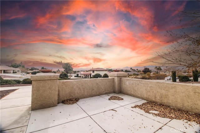 view of patio terrace at dusk