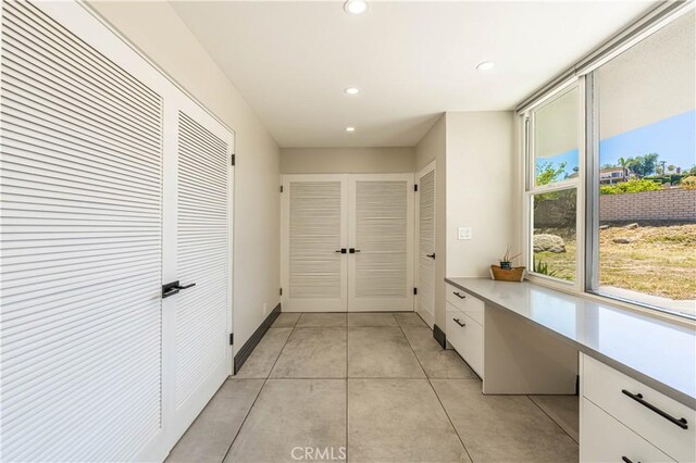 10220 Balmoral Ct, Riverside, CA 92503 - corridor with recessed lighting, light tile patterned floors, and baseboards