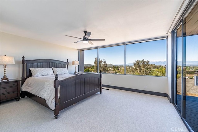 10220 Balmoral Ct, Riverside, CA 92503 - carpeted bedroom featuring access to exterior, ceiling fan, and baseboards