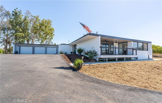 10220 Balmoral Ct, Riverside, CA 92503 - view of front of house featuring a garage and ceiling fan