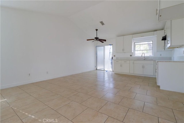 14256 Parkview Dr, Fontana, CA 92337 - unfurnished living room featuring a sink, vaulted ceiling, a ceiling fan, light tile patterned floors, and baseboards