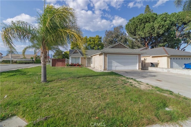 ranch-style house featuring driveway, an attached garage, and a front lawn
