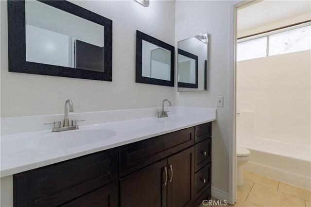 14256 Parkview Dr, Fontana, CA 92337 - full bathroom with toilet, double vanity, and tile patterned flooring