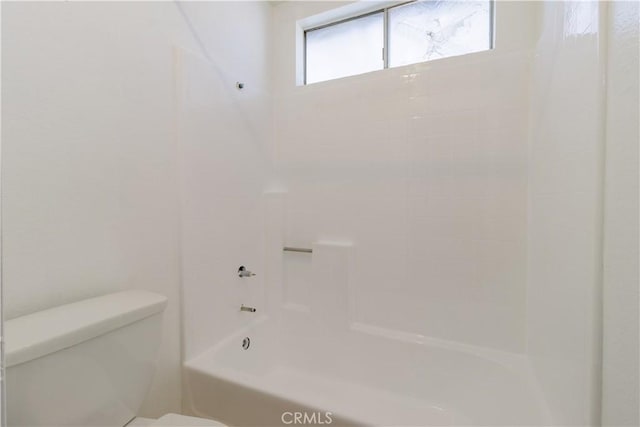 bathroom with toilet and shower / bath combination