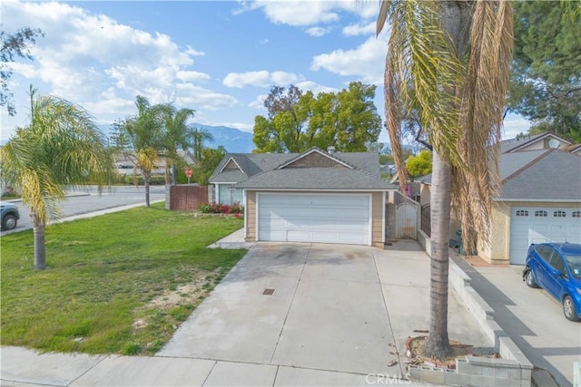 ranch-style house featuring a front lawn, a gate, and concrete driveway