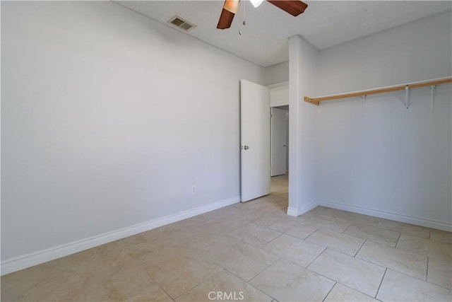 unfurnished bedroom featuring baseboards, visible vents, and a ceiling fan