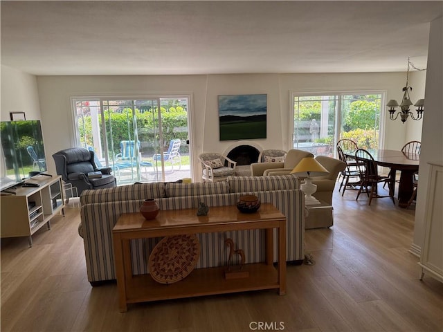 5219 Moya, Laguna Woods, CA 92637 - living area with a chandelier and wood finished floors