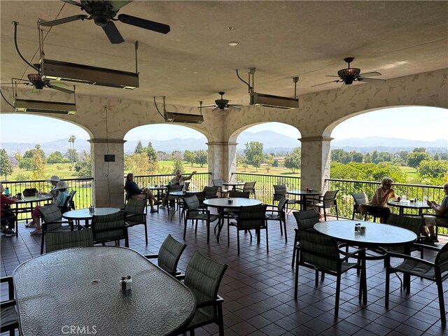 5219 Moya, Laguna Woods, CA 92637 - view of patio / terrace with outdoor dining space, a ceiling fan, and a mountain view