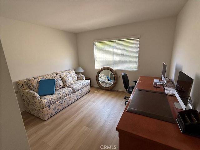 home office with wood finished floors and baseboards