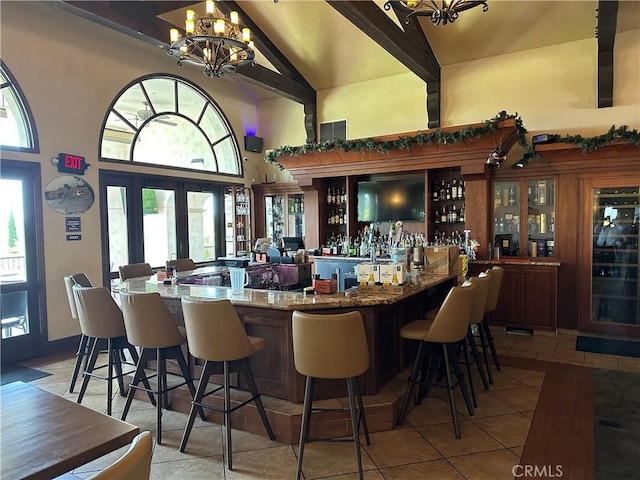 5219 Moya, Laguna Woods, CA 92637 - indoor dry bar with high vaulted ceiling, a chandelier, light tile patterned flooring, and beamed ceiling