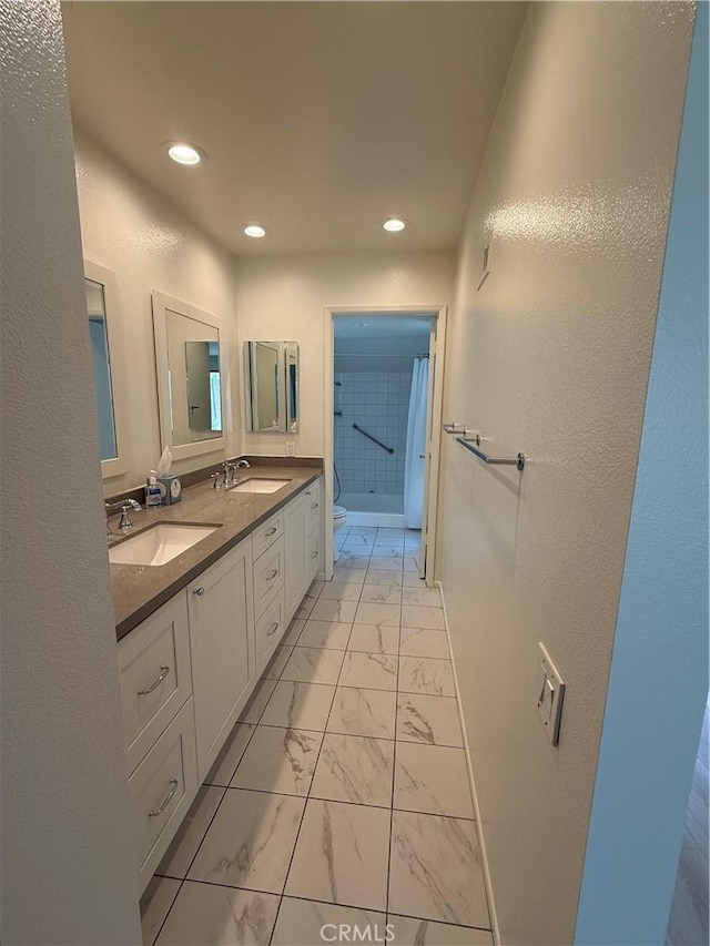 5219 Moya, Laguna Woods, CA 92637 - bathroom featuring marble finish flooring, double vanity, a shower, and recessed lighting