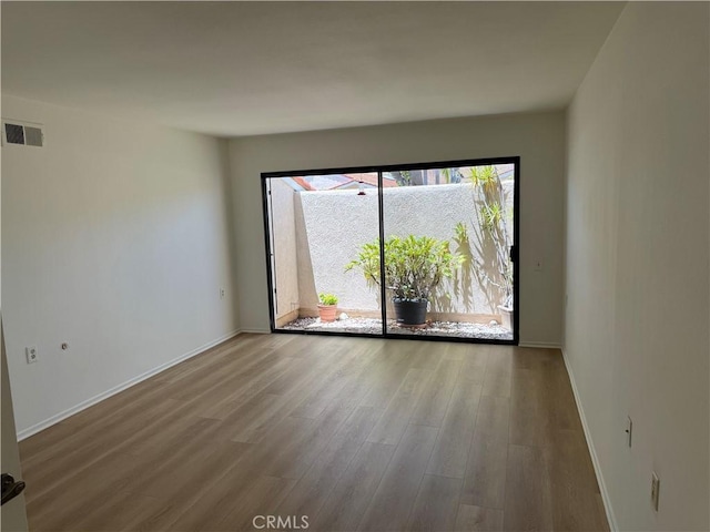 5219 Moya, Laguna Woods, CA 92637 - spare room with wood finished floors and baseboards