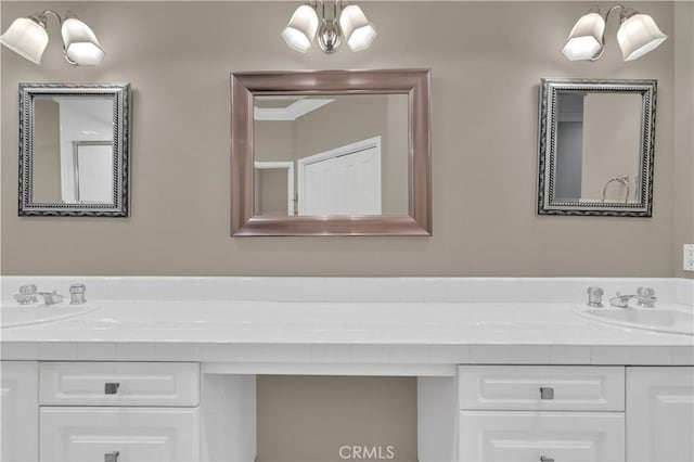 57 Plaza Brisas, San Juan Capistrano, CA 92675 - bathroom featuring double vanity, a sink, and a notable chandelier
