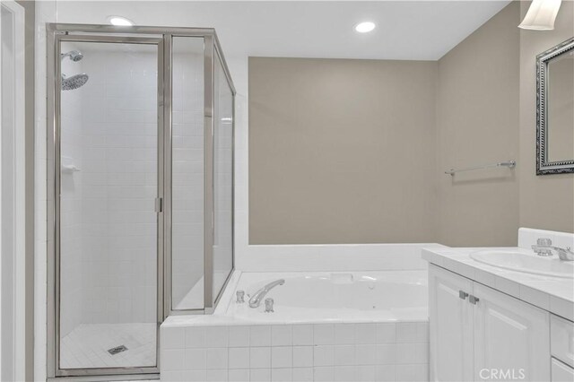 57 Plaza Brisas, San Juan Capistrano, CA 92675 - full bathroom with a bath, a stall shower, vanity, and recessed lighting