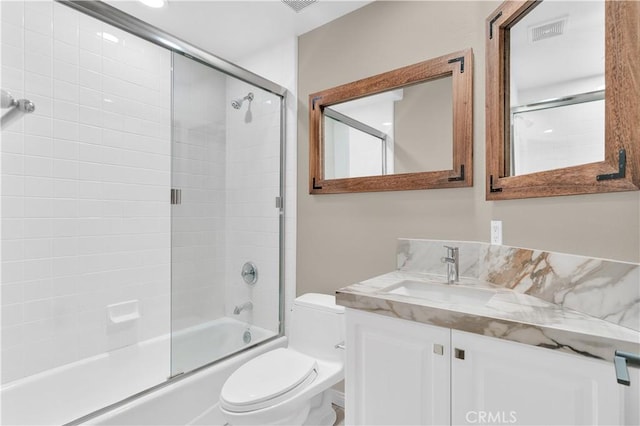 57 Plaza Brisas, San Juan Capistrano, CA 92675 - full bath featuring bath / shower combo with glass door, vanity, visible vents, and toilet