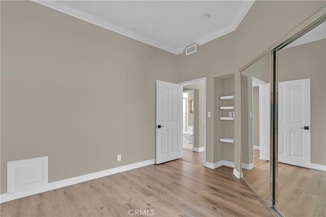 57 Plaza Brisas, San Juan Capistrano, CA 92675 - unfurnished bedroom with light wood-type flooring, baseboards, ornamental molding, and visible vents