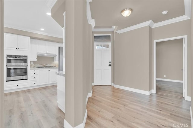 57 Plaza Brisas, San Juan Capistrano, CA 92675 - foyer with crown molding, light wood-style flooring, and baseboards