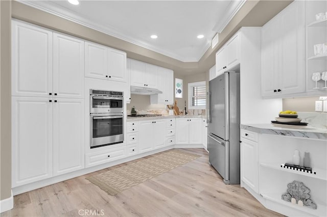 57 Plaza Brisas, San Juan Capistrano, CA 92675 - kitchen with open shelves, ornamental molding, under cabinet range hood, recessed lighting, and stainless steel appliances