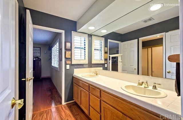 29839 Circle R Creek Ln, Escondido, CA 92026 - bathroom featuring wood finished floors, double vanity, and baseboards