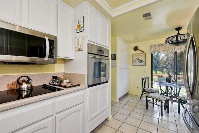 29839 Circle R Creek Ln, Escondido, CA 92026 - kitchen with appliances with stainless steel finishes, white cabinets, light countertops, and light tile patterned floors