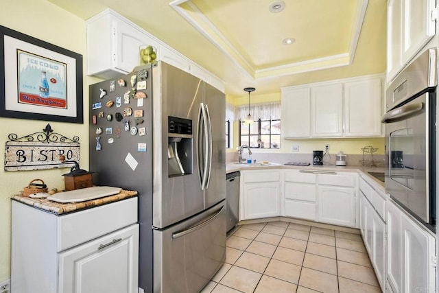 29839 Circle R Creek Ln, Escondido, CA 92026 - kitchen featuring stainless steel appliances, white cabinetry, a raised ceiling, light tile patterned flooring, and hanging light fixtures