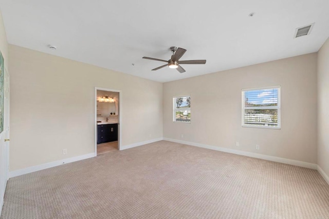 20191 Deerben Rd, Ramona, CA 92065 - unfurnished bedroom with light carpet, baseboards, ceiling fan, and connected bathroom