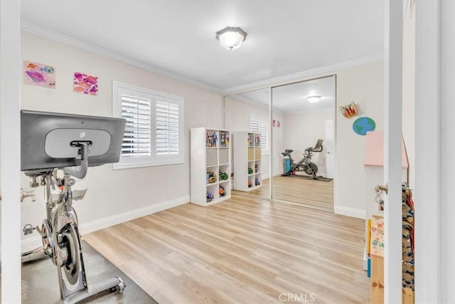 9056 Oswego St, Sunland, CA 91040 - exercise area featuring crown molding, baseboards, and wood finished floors