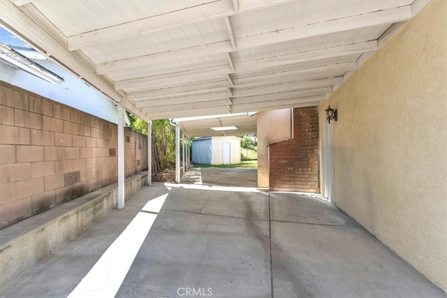 9056 Oswego St, Sunland, CA 91040 - view of patio with an outbuilding, a shed, and a carport