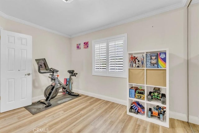 9056 Oswego St, Sunland, CA 91040 - workout room featuring crown molding, baseboards, and wood finished floors