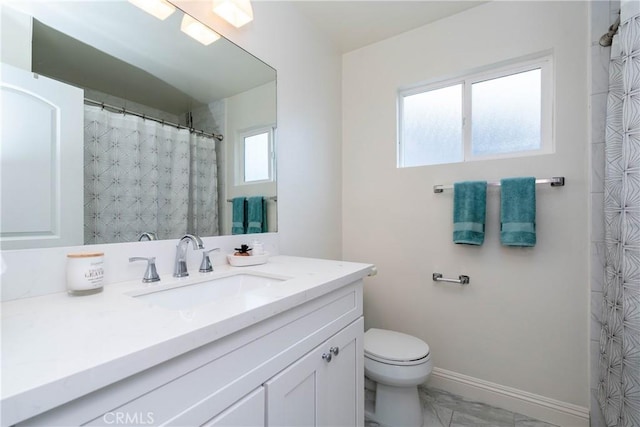 24461 Peacock St, Lake Forest, CA 92630 - full bathroom with vanity, toilet, marble look tile flooring, and baseboards