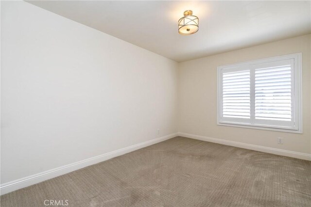 24461 Peacock St, Lake Forest, CA 92630 - unfurnished room with baseboards and light colored carpet