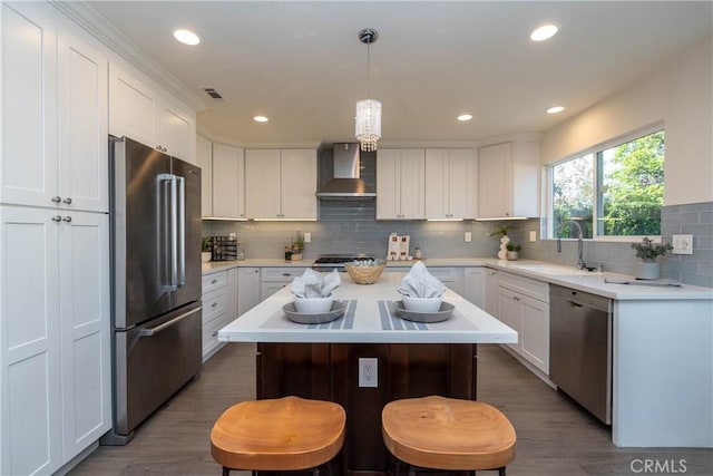 24461 Peacock St, Lake Forest, CA 92630 - kitchen with appliances with stainless steel finishes, wall chimney range hood, a sink, tasteful backsplash, and light countertops