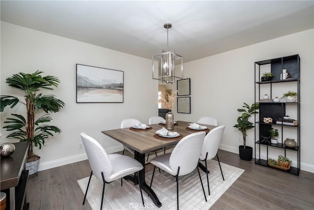 24461 Peacock St, Lake Forest, CA 92630 - dining room featuring a chandelier, wood finished floors, and baseboards