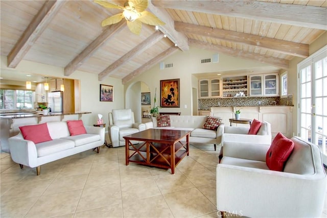 living room with arched walkways, a ceiling fan, visible vents, wooden ceiling, and light tile patterned flooring