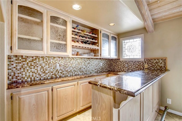 bar with backsplash, baseboards, recessed lighting, and light tile patterned floors
