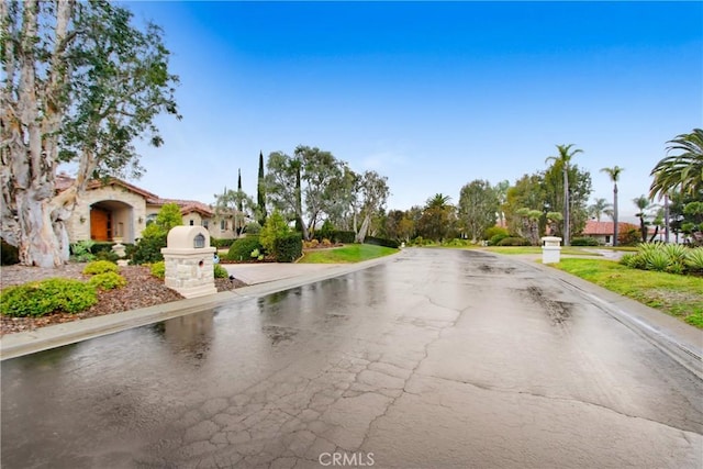 view of road featuring curbs