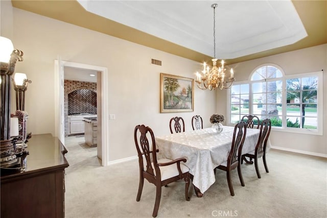 dining area with light carpet, visible vents, baseboards, and a chandelier