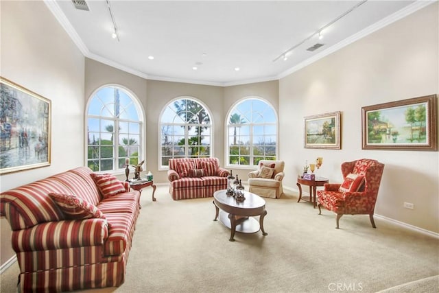 living room with crown molding, rail lighting, visible vents, carpet floors, and a healthy amount of sunlight