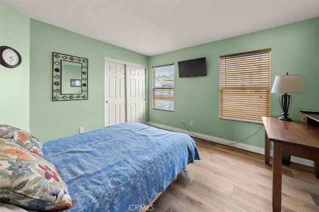 14209 Wrangell Ln, Canyon Country, CA 91387 - bedroom featuring baseboards and wood finished floors