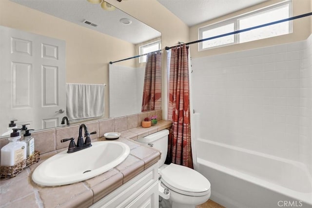 14209 Wrangell Ln, Canyon Country, CA 91387 - full bathroom with toilet, shower / tub combo with curtain, vanity, and a textured ceiling