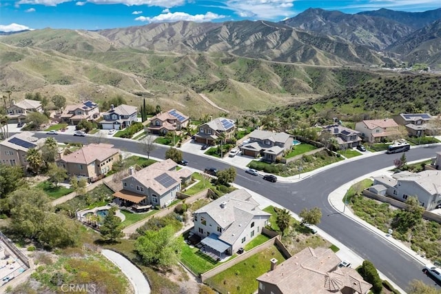 14209 Wrangell Ln, Canyon Country, CA 91387 - aerial overview of property's location with nearby suburban area and a mountainous background