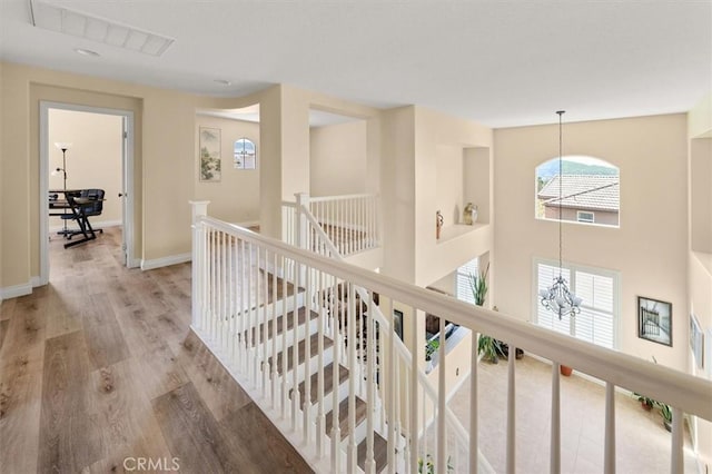 14209 Wrangell Ln, Canyon Country, CA 91387 - corridor with a chandelier, an upstairs landing, wood finished floors, baseboards, and recessed lighting