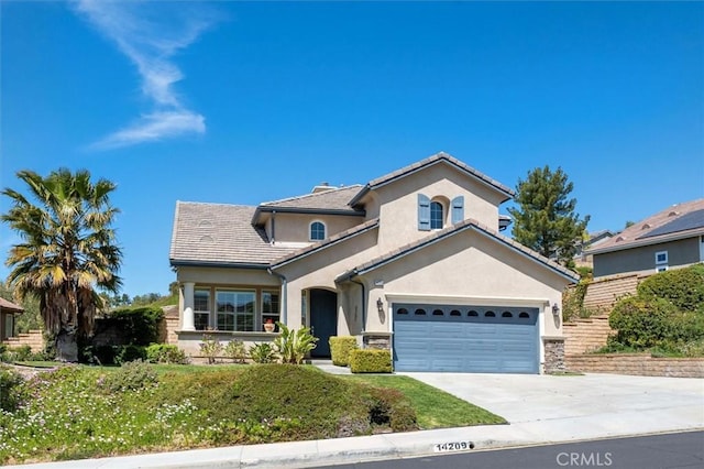 14209 Wrangell Ln, Canyon Country, CA 91387 - view of front facade featuring stucco siding, driveway, an attached garage, and a front yard