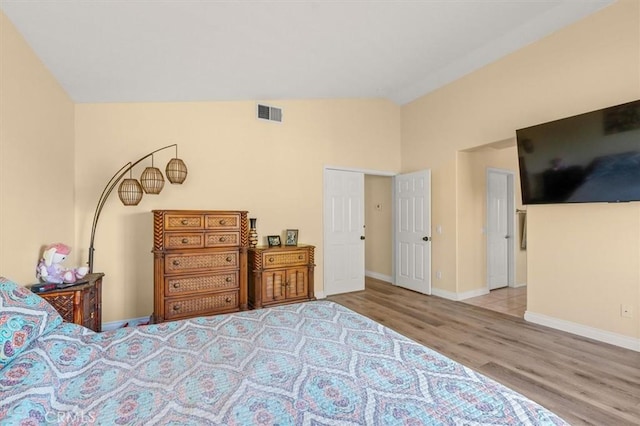 14209 Wrangell Ln, Canyon Country, CA 91387 - bedroom featuring wood finished floors, baseboards, and high vaulted ceiling