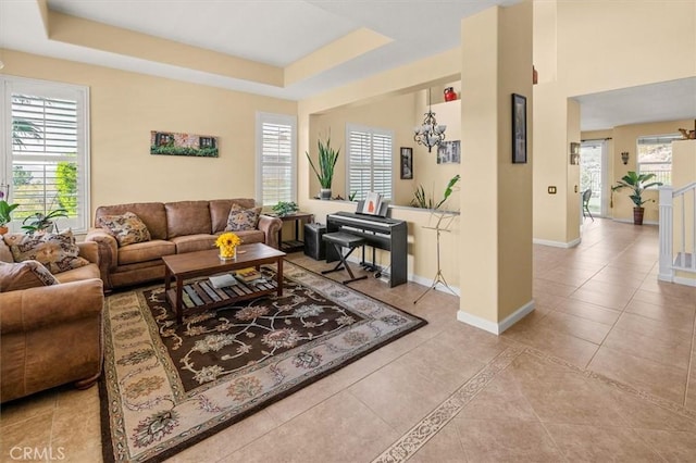 14209 Wrangell Ln, Canyon Country, CA 91387 - living room with tile patterned flooring, baseboards, and a tray ceiling